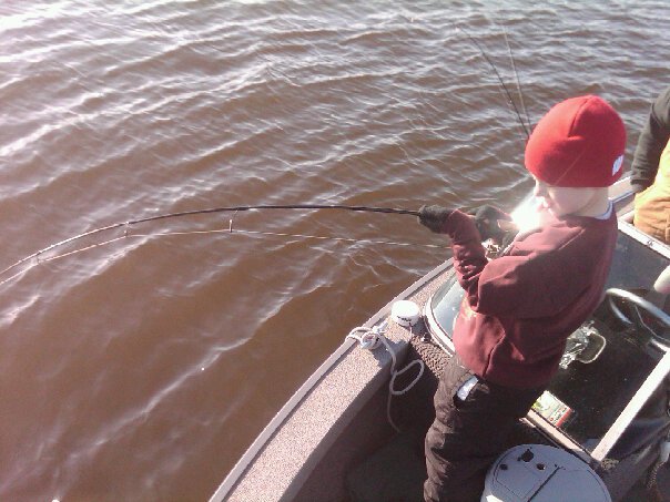 8yr old fighting a sturgeon twice the size he is